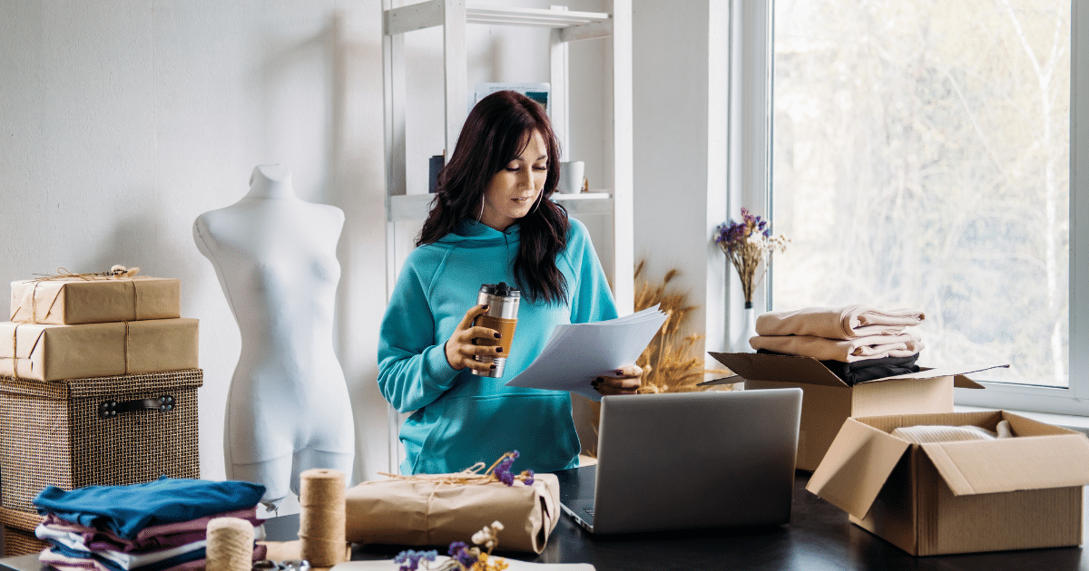Business owner reviewing purchase orders with financing options, showcasing growth potential and operational efficiency.
