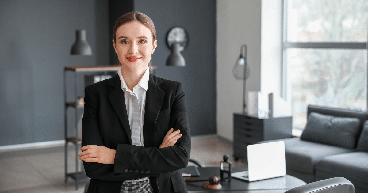 Professional woman in business attire in a modern office, representing small business operations and the Affordable Care Act impacts.
