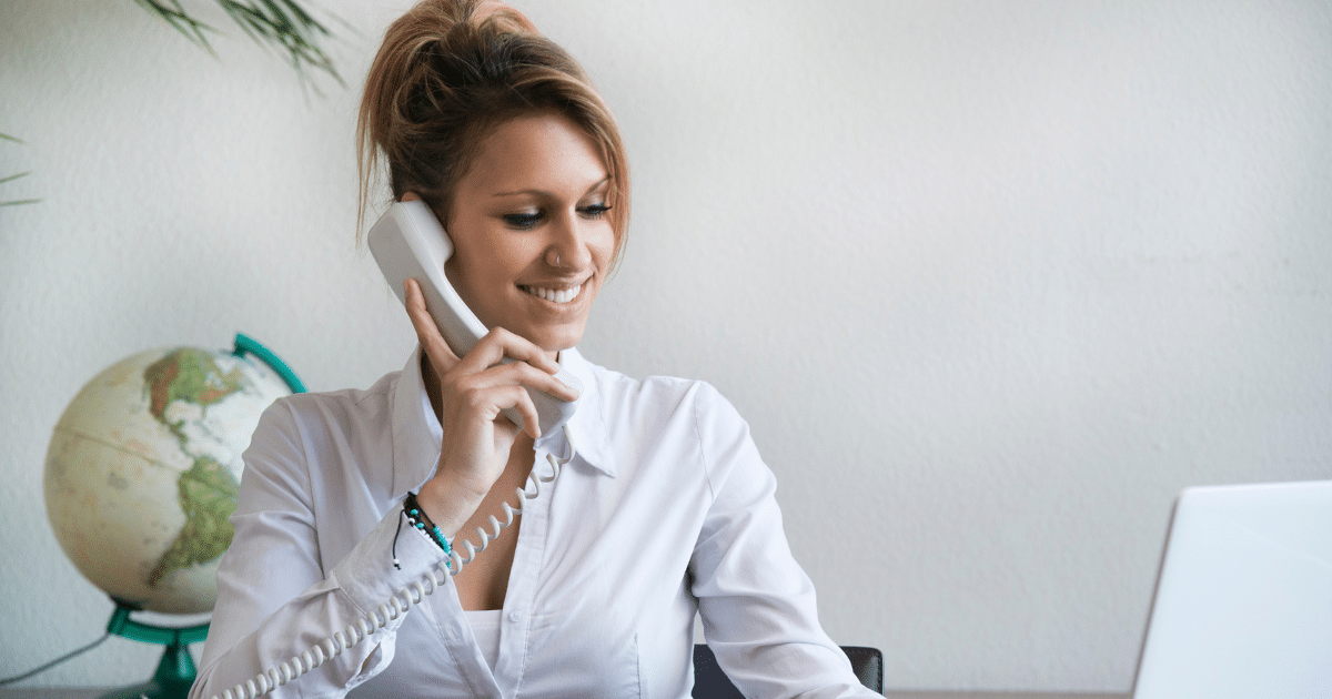 Businesswoman on the phone discussing private equity risks for small business funding and growth opportunities.