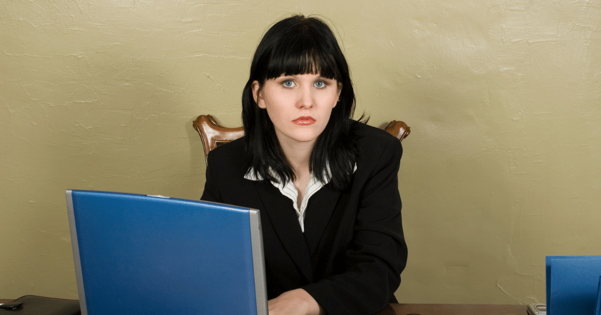 Businesswoman at desk preparing for holiday sales, emphasizing the importance of funding for Black Friday and Cyber Monday.