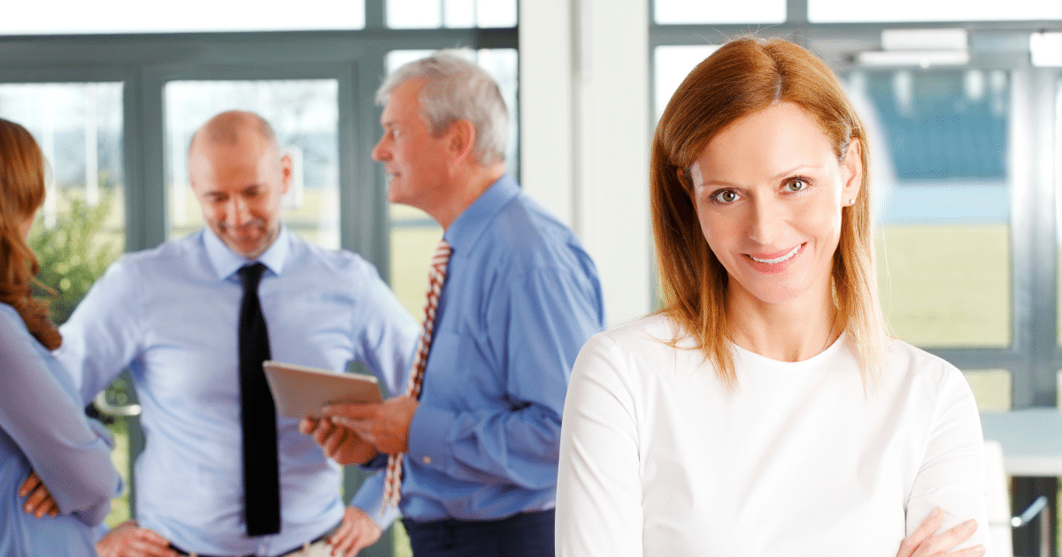 Business professionals collaborating in an office setting, emphasizing effective strategies for competition and customer engagement.