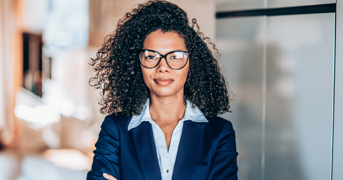 Professional woman in business attire, representing innovative holiday marketing ideas for small business growth.