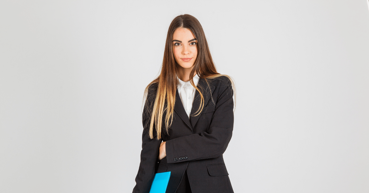 Professional woman in a suit holding a blue folder, representing customer engagement strategies in business.