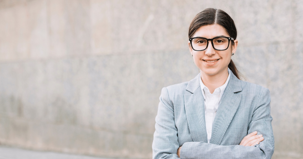 Business professional in a suit, showcasing confidence and leadership in a modern corporate environment.