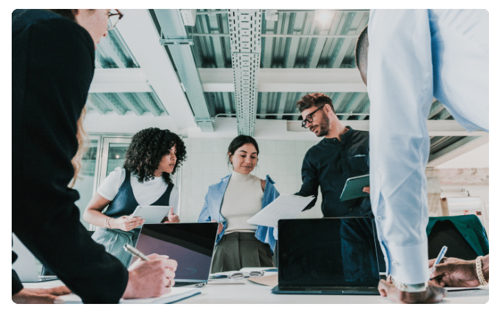 Team collaborating on HR automation strategies, highlighting the importance of efficient HR processes for small business success.
