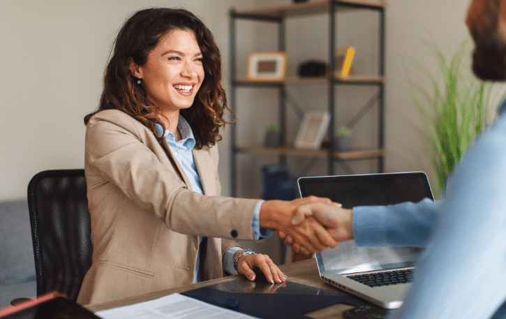 Business professional shaking hands, symbolizing partnership and funding solutions at Advance Funds Network.